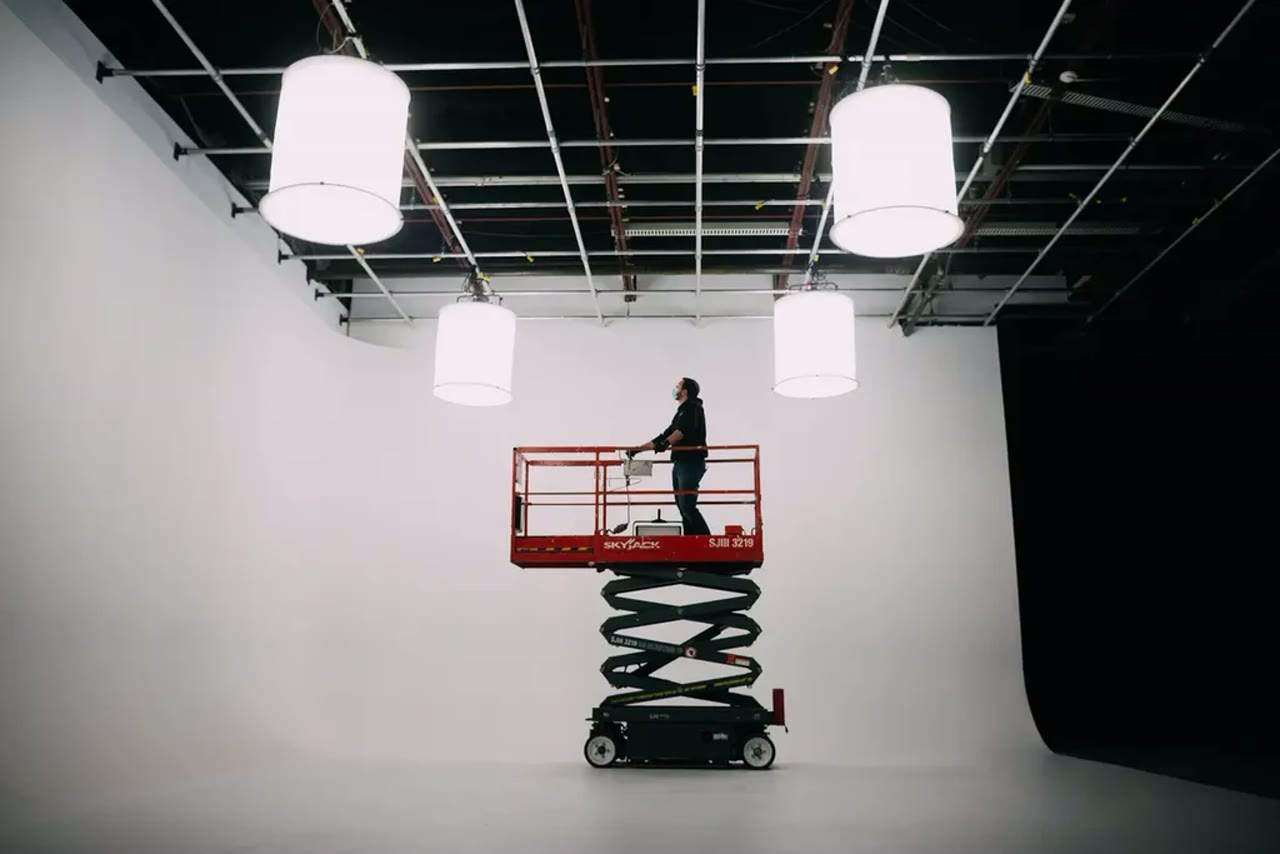 Overhead lighting grid above the cyc wall